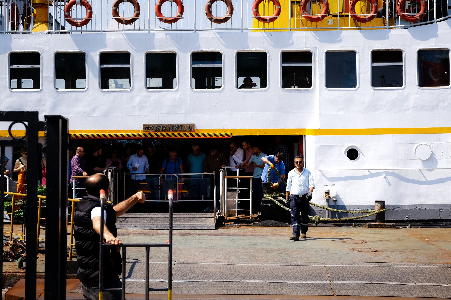 Passenger disembarking ferry at Istanbul harbor