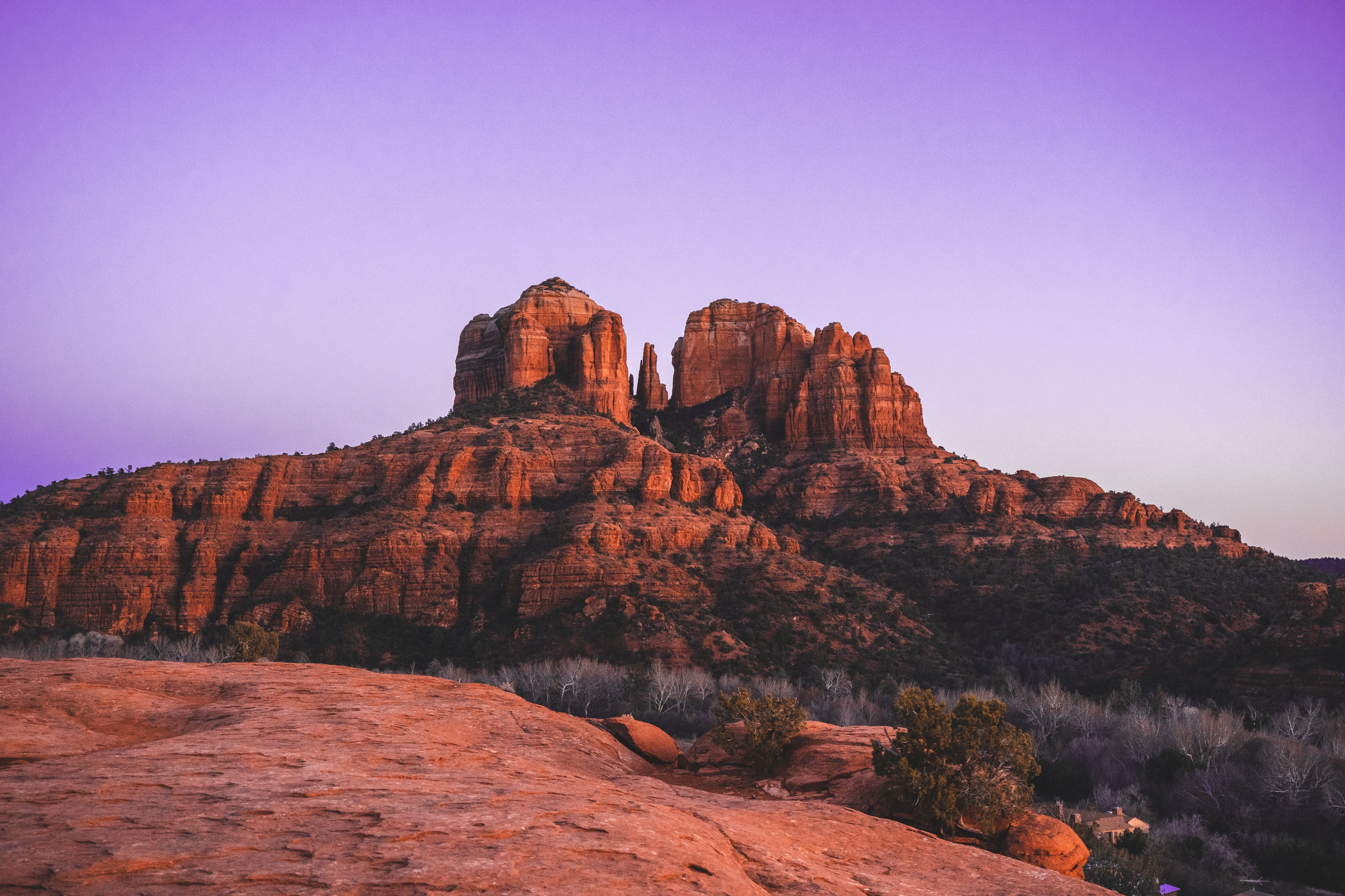 Cathedral Rock sandstone formation reflected in Oak Creek at golden hour, Sedona, Arizona