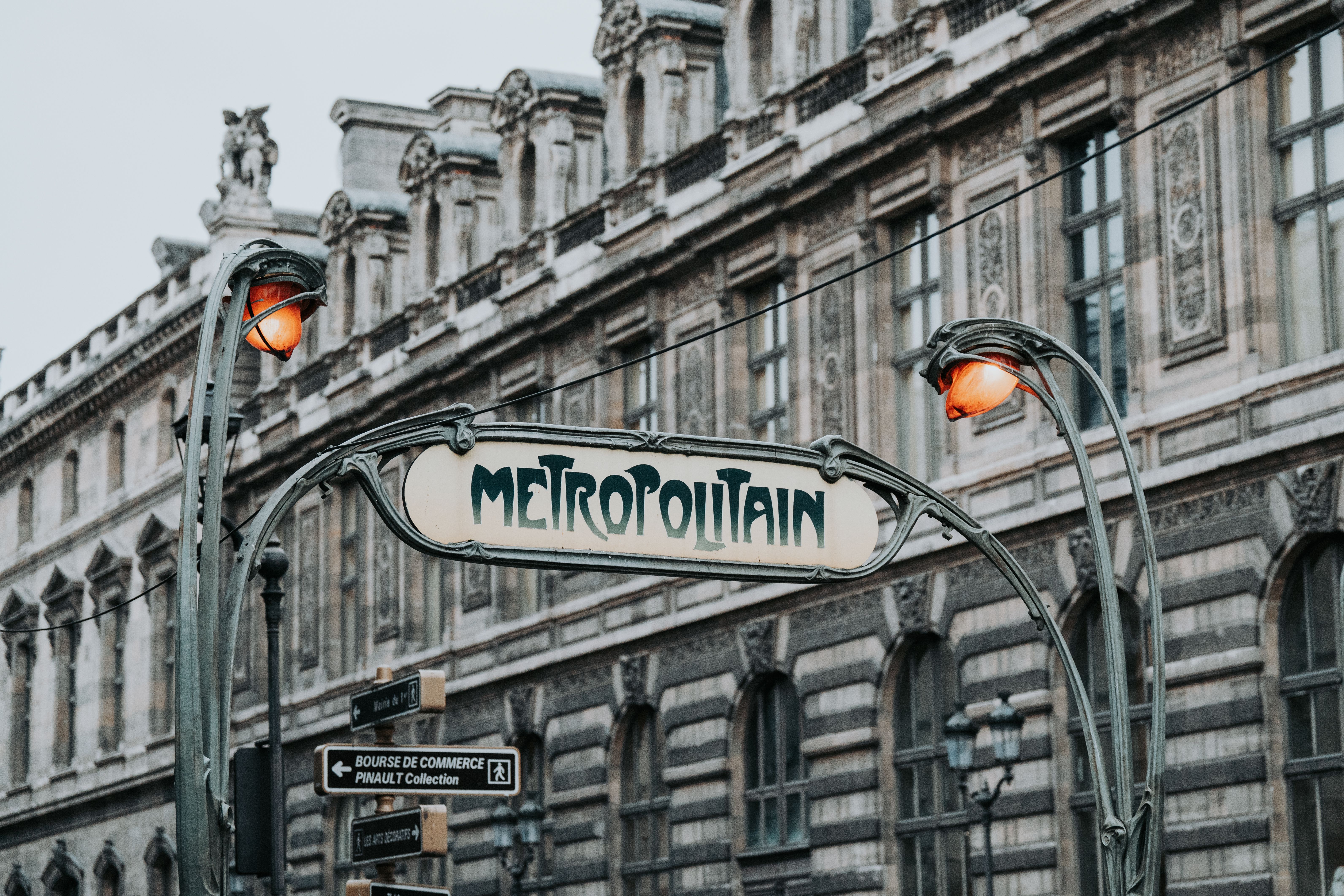 Hector Guimard-designed Art Nouveau entrance to the Abbesses Métro station in Montmartre, Paris, with organic green metalwork and glass canopy