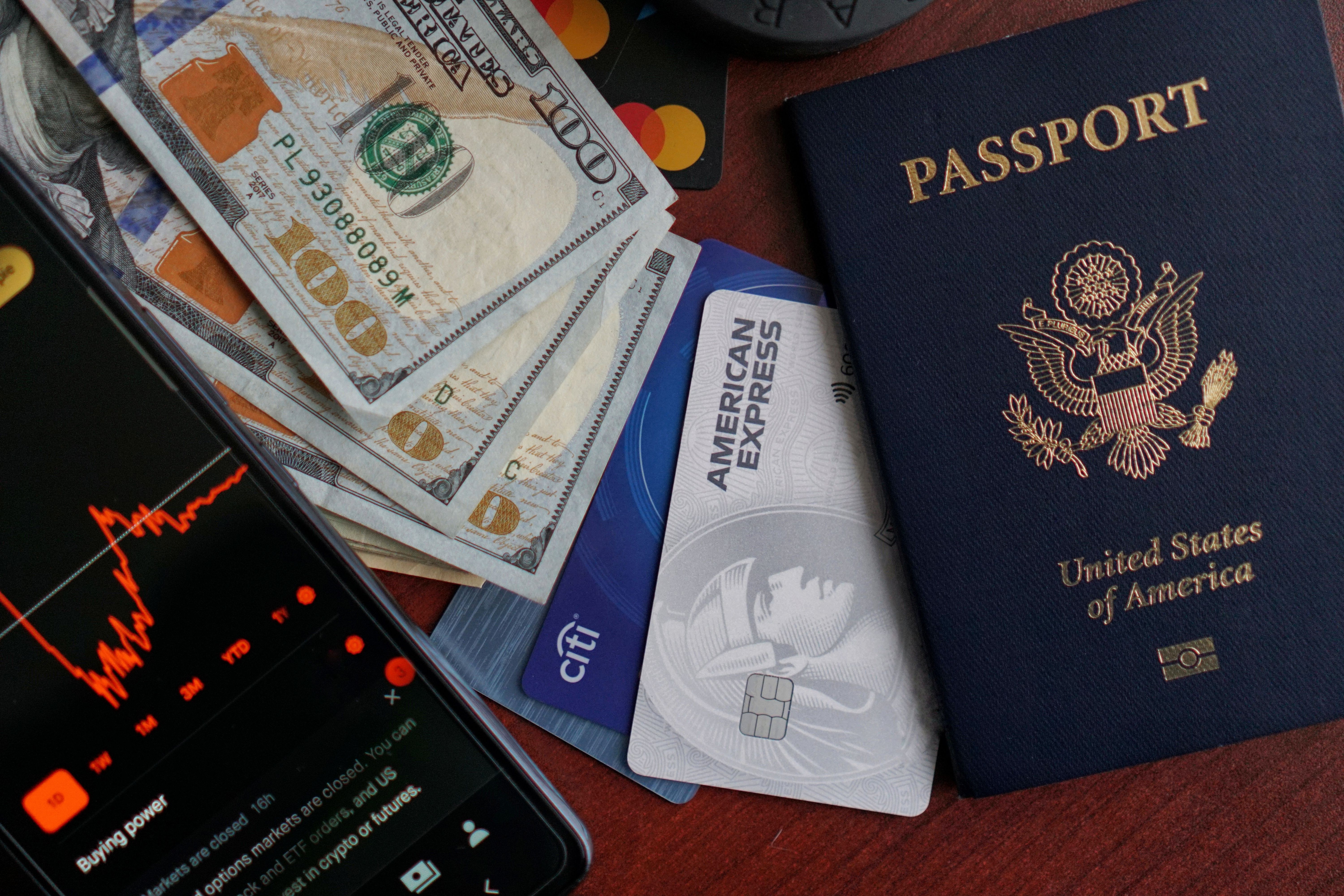Chase Sapphire Reserve credit card resting on top of an open passport with travel documents