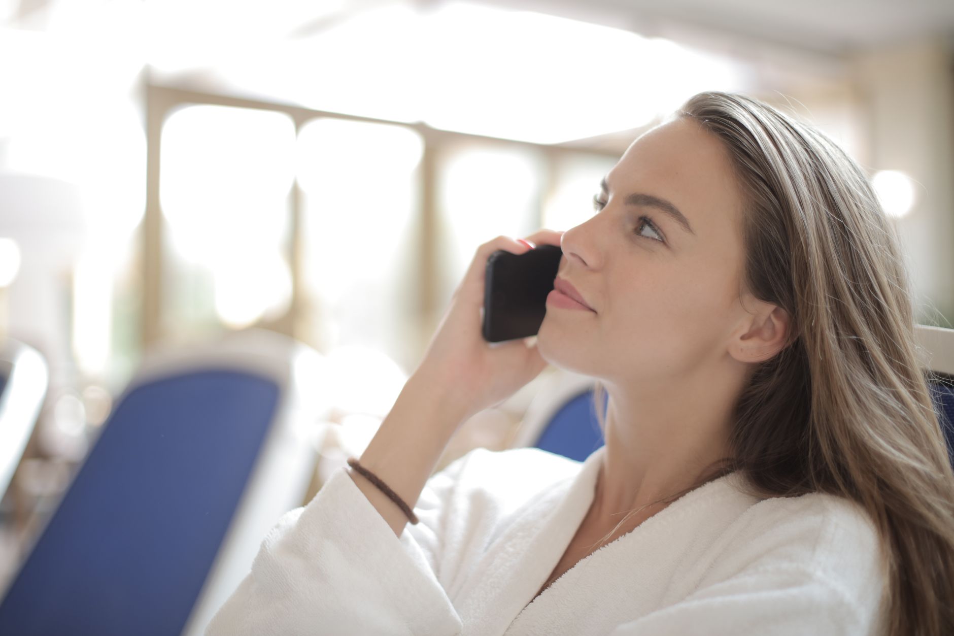 Traveler on phone call in Oahu hotel lobby