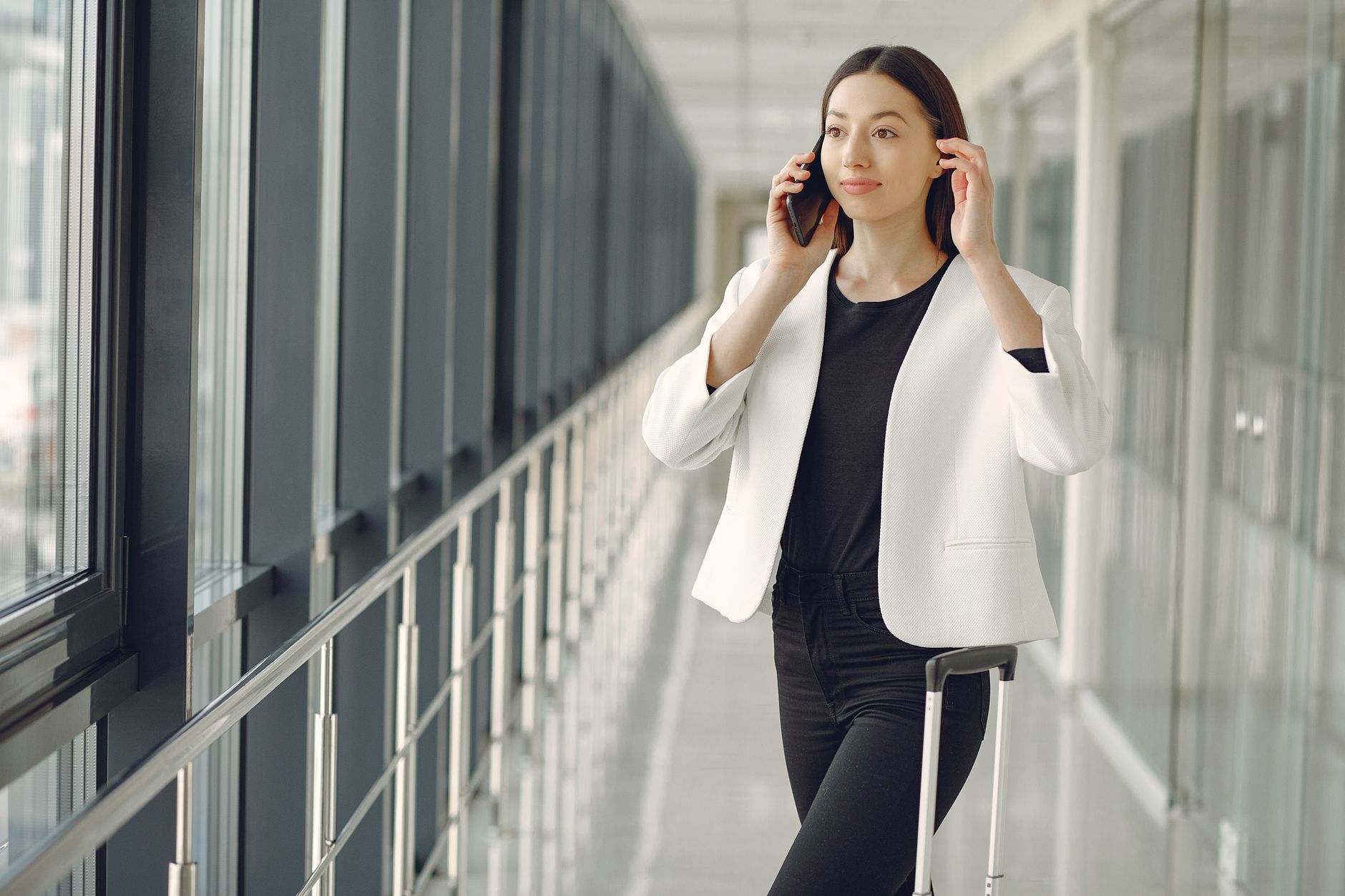 Woman on phone call in airport terminal
