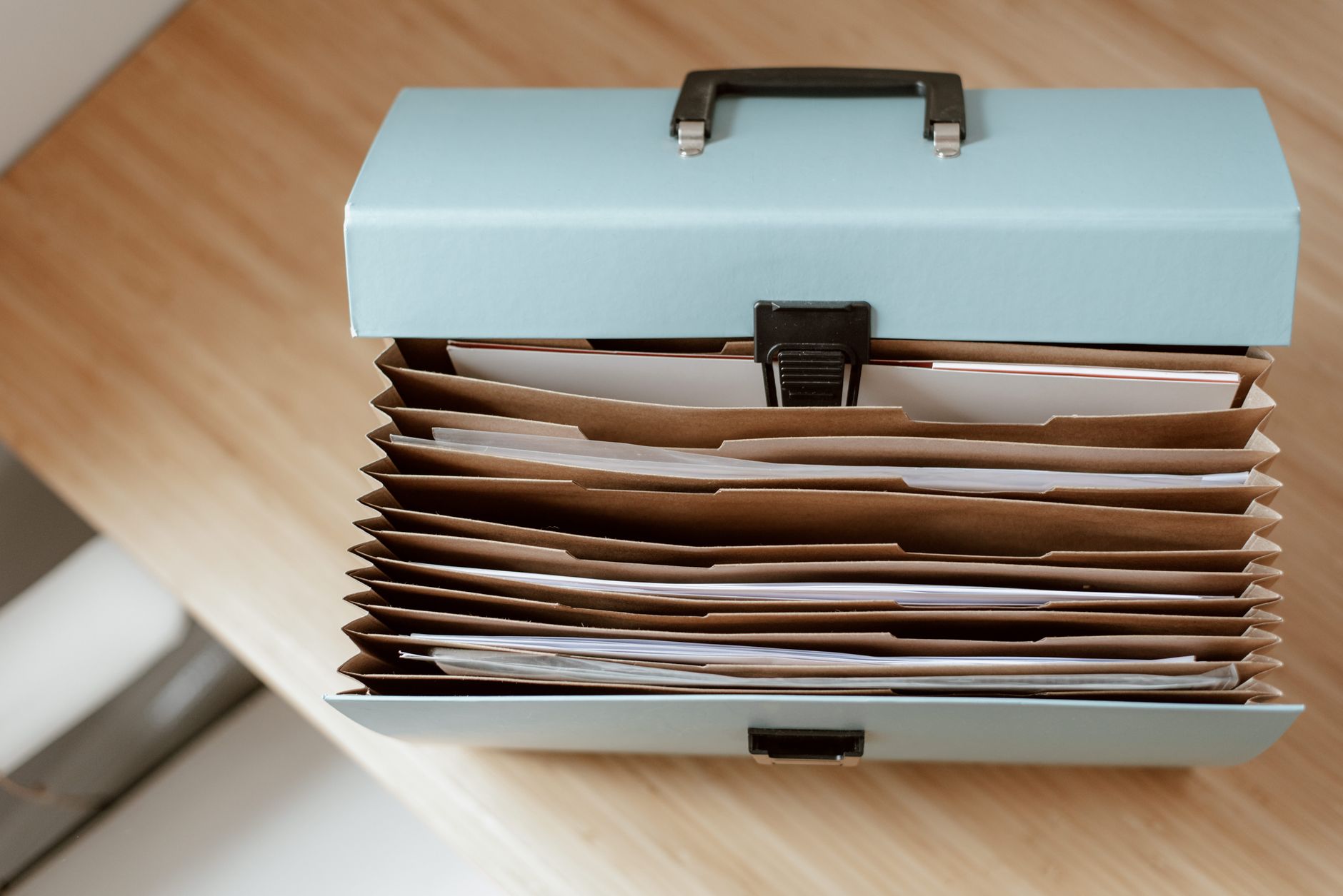Traveler with organized folder of receipts and claim documents