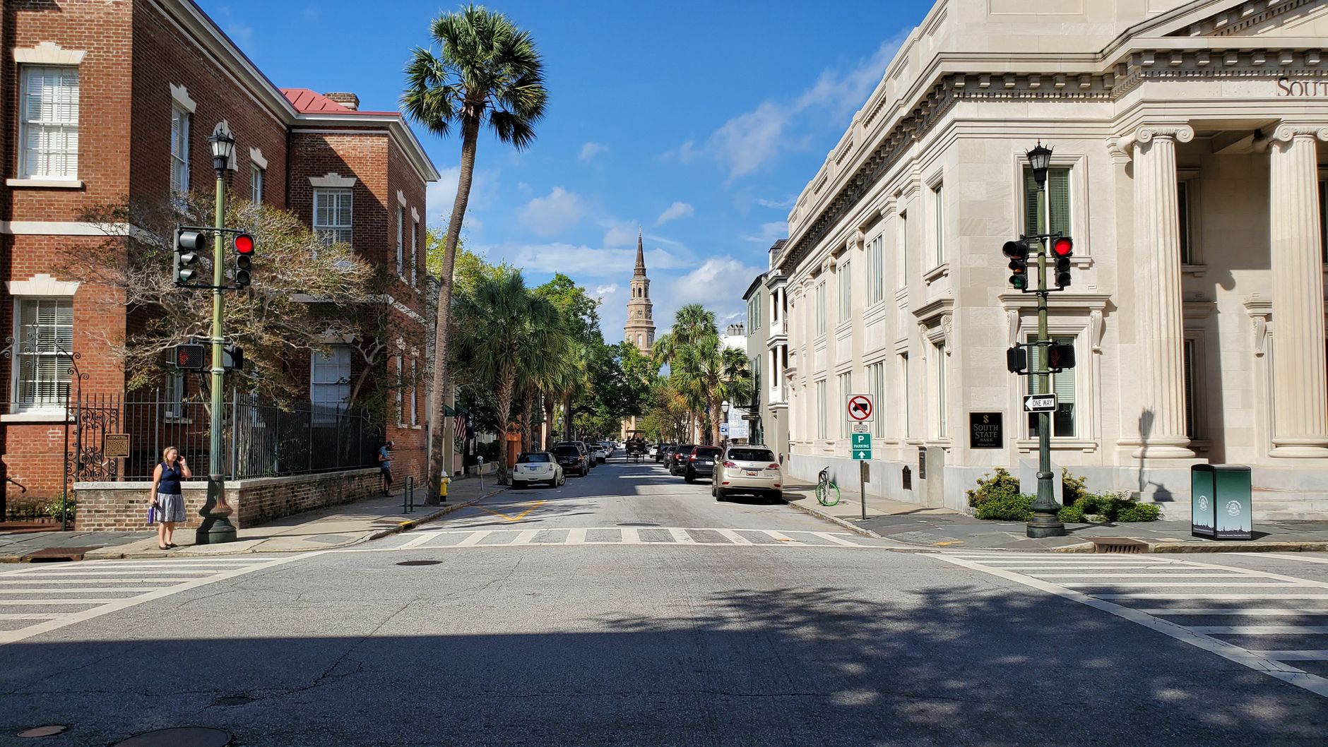 Historic hotels on Charleston street with pedestrians in daylight