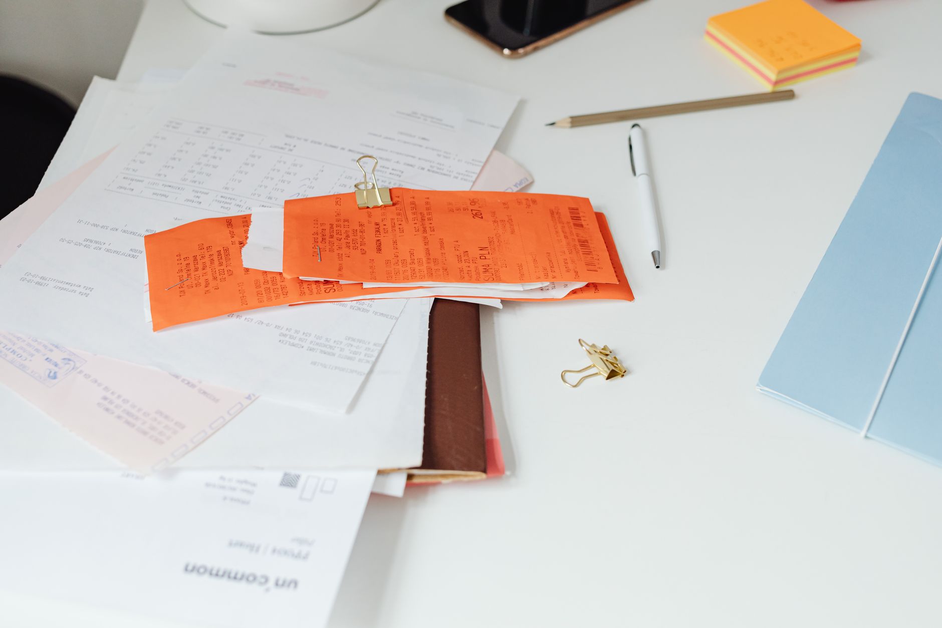 Travel documents and receipts organized on table
